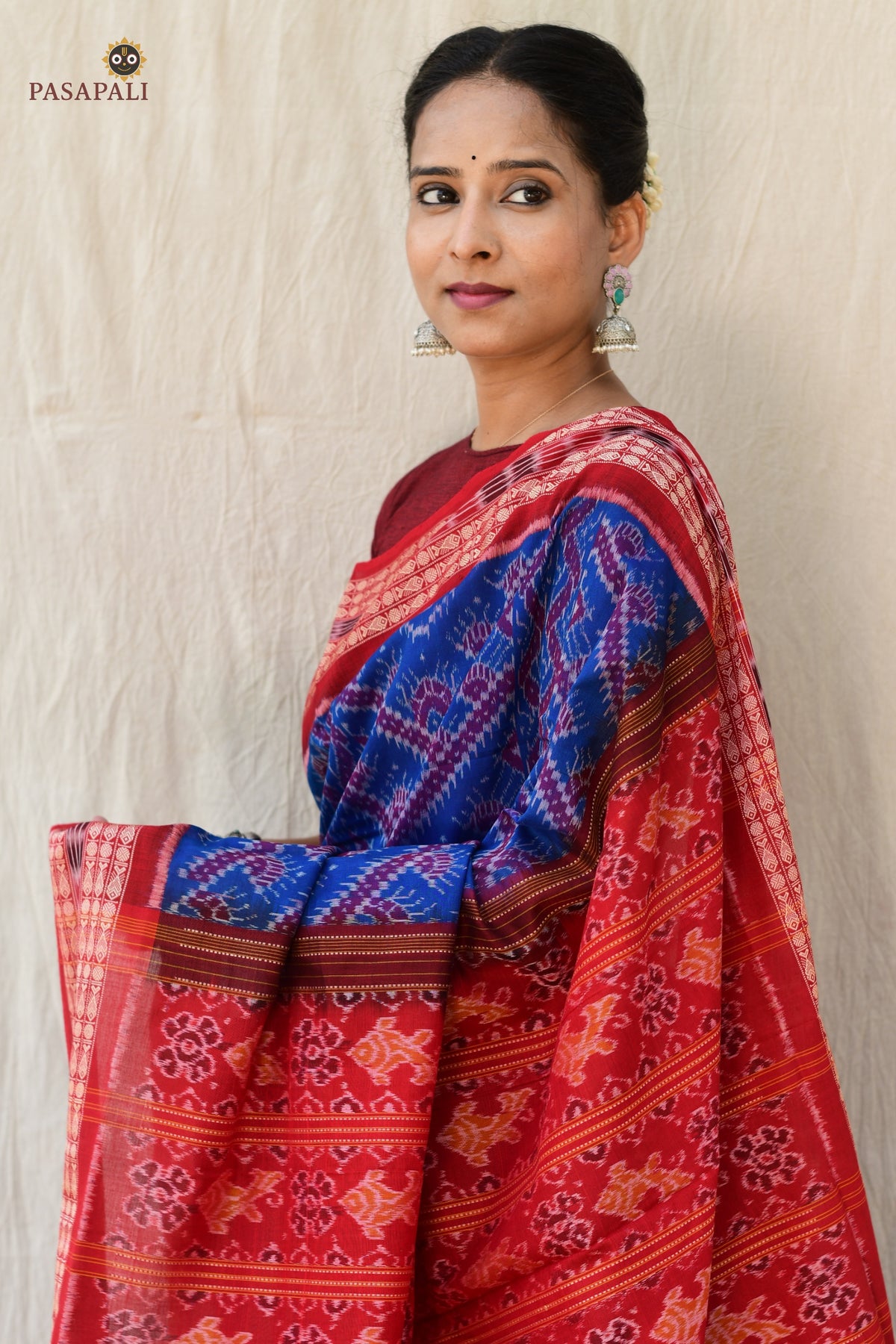 Ikat motif detail on Kaumudi Sambalpuri Bandha saree — fish and flower resist-dyed using Bandhakala technique