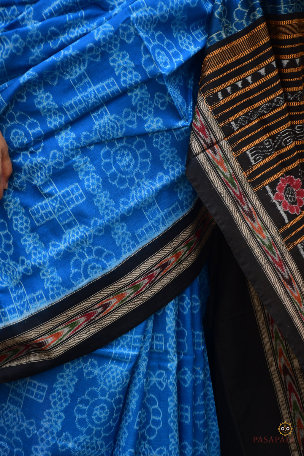 Overall flat lay of Kaushalya — Blue and Black Sambalpuri Bandha mercerized cotton saree with full border and pallu, Pasapali