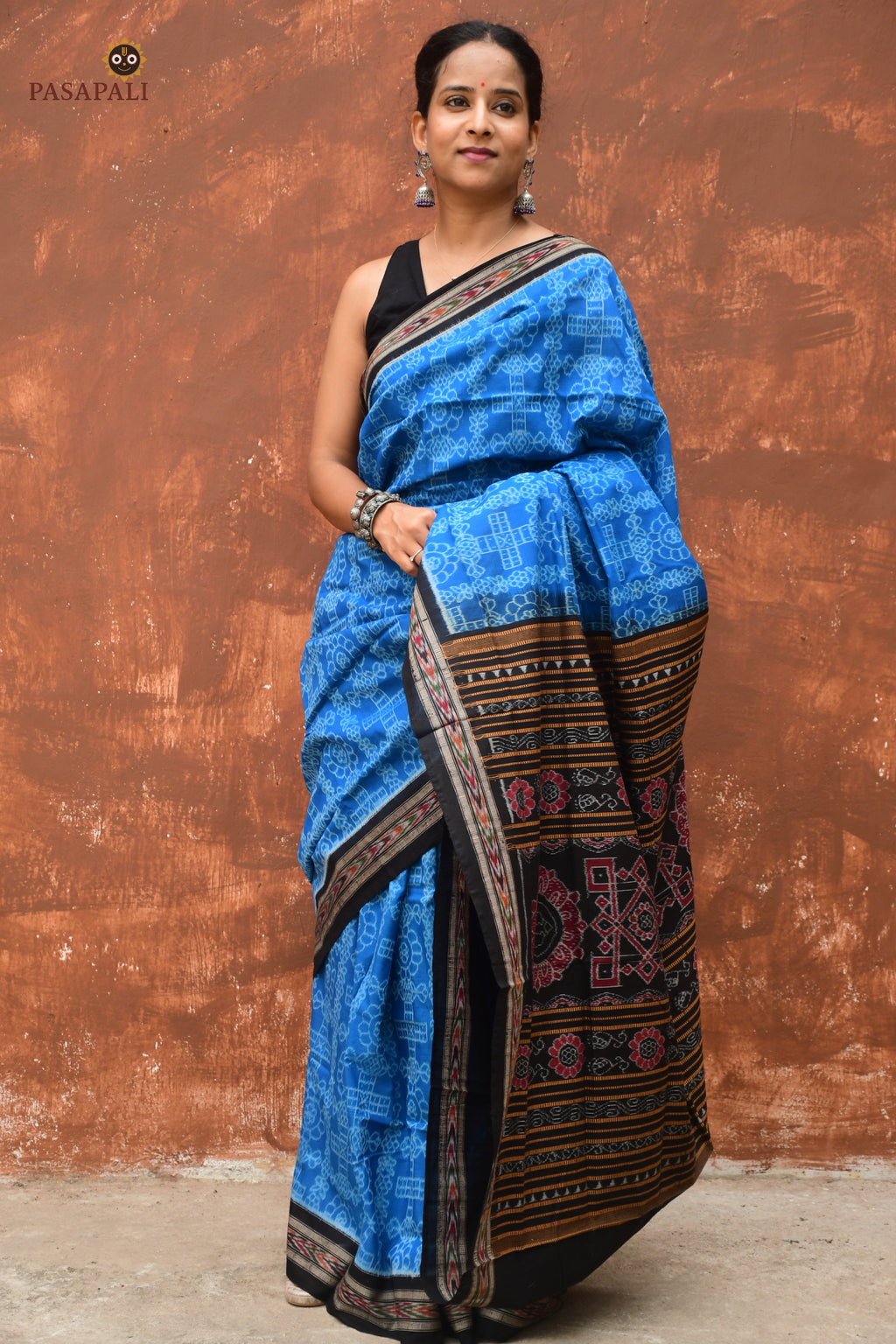 Kaushalya Sambalpuri cotton saree draped front view — Blue and Black Bandha ikat with flower motifs on body by Pasapali