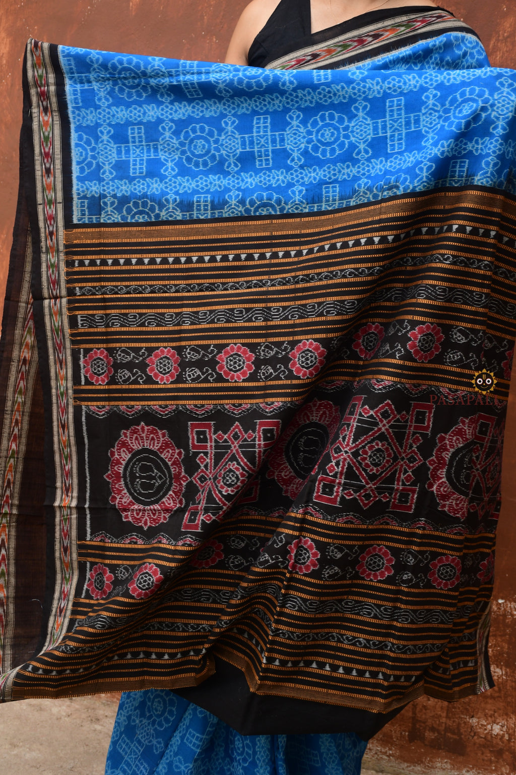 Kaushalya Blue Sambalpuri Bandha saree folded flat — Black and Blue mercerized cotton handloom, Pasapali Odisha