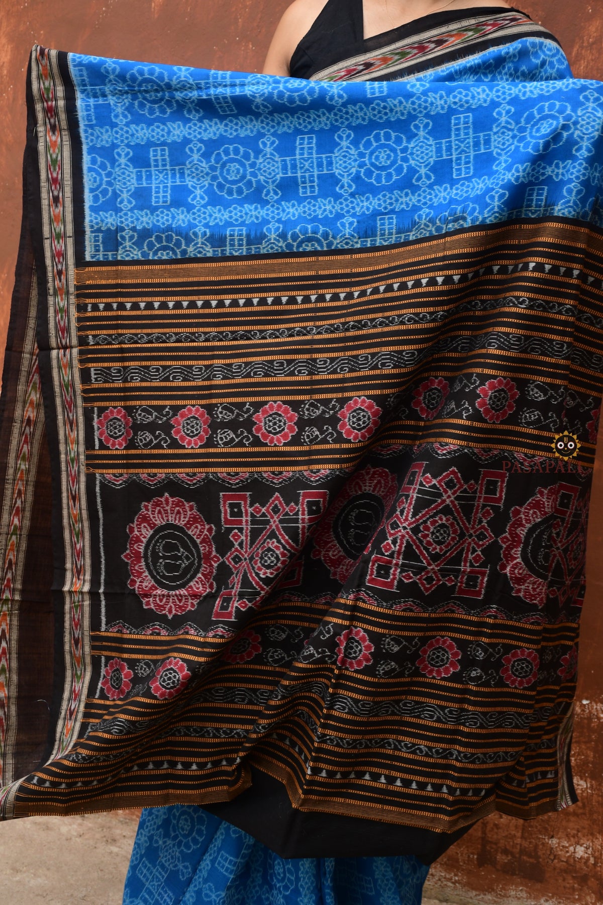 Kaushalya Blue Sambalpuri Bandha saree folded flat — Black and Blue mercerized cotton handloom, Pasapali Odisha