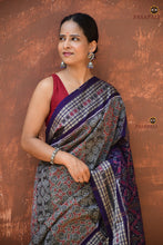 Load image into Gallery viewer, Kusumalata grey Sambalpuri cotton saree front drape view — rust and blue Bandha double ikat motifs visible across body
