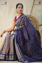 Load image into Gallery viewer, Folded saree view of Kusumalata grey Sambalpuri Bandha saree — fish border and floral pallu visible, GI certified handloom

