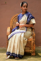 Folded view of Kusumavali off-white Sambalpuri cotton saree showing blue border and phula motif pallu — Pasapali handloom collection