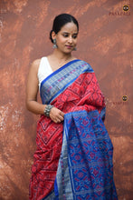 Load image into Gallery viewer, Kusumita Sambalpuri Bandha saree — close-up of Rudraksha motif border in red and blue mercerized cotton

