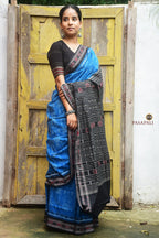 Body weave detail showing shankha and Lakshmi paado motifs on blue Sambalpuri Bandha saree — Pasapali