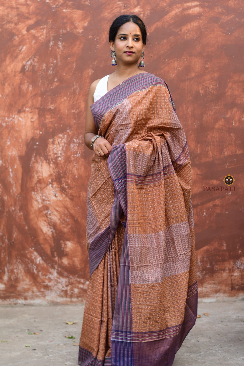 Lekhika Sambalpuri cotton saree draped front view — Bandha double ikat checks in light brown and navy blue, Pasapali