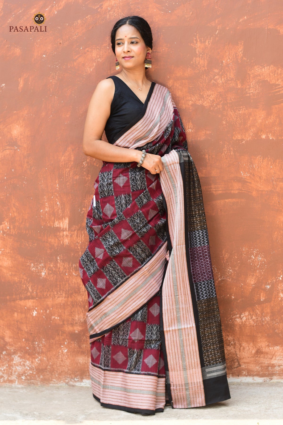 Lopamudra — front drape of maroon Sambalpuri cotton saree showing diamond butas and black border by Pasapali