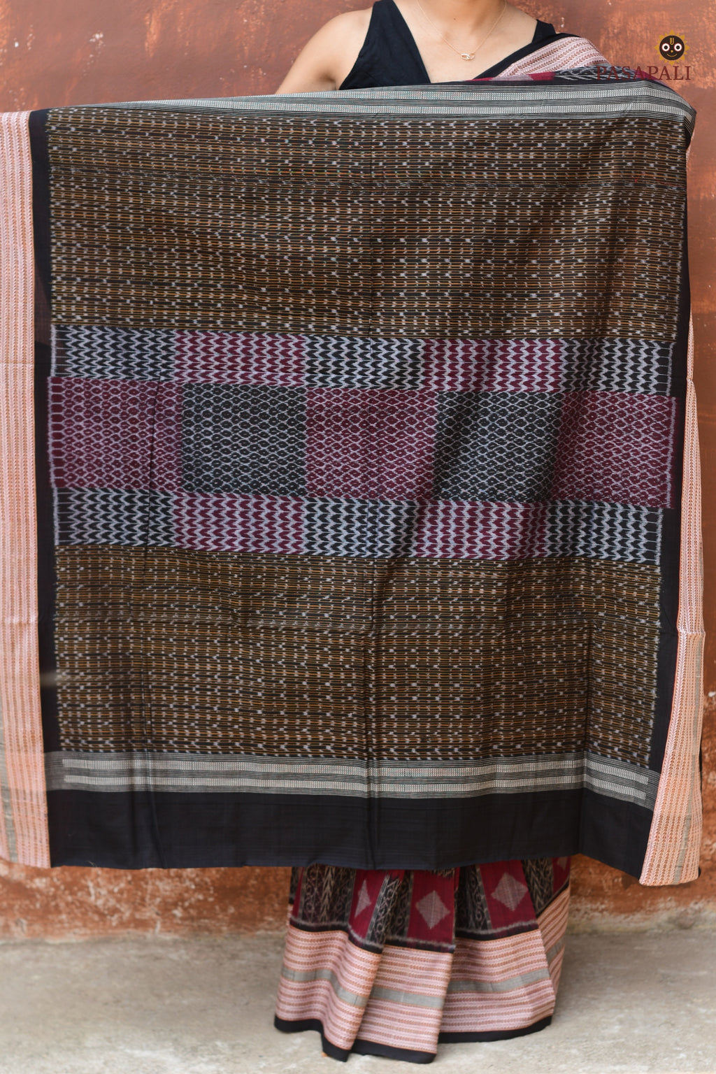 Lopamudra — folded saree showing maroon and black palette of Sambalpuri Bandha cotton saree by Pasapali