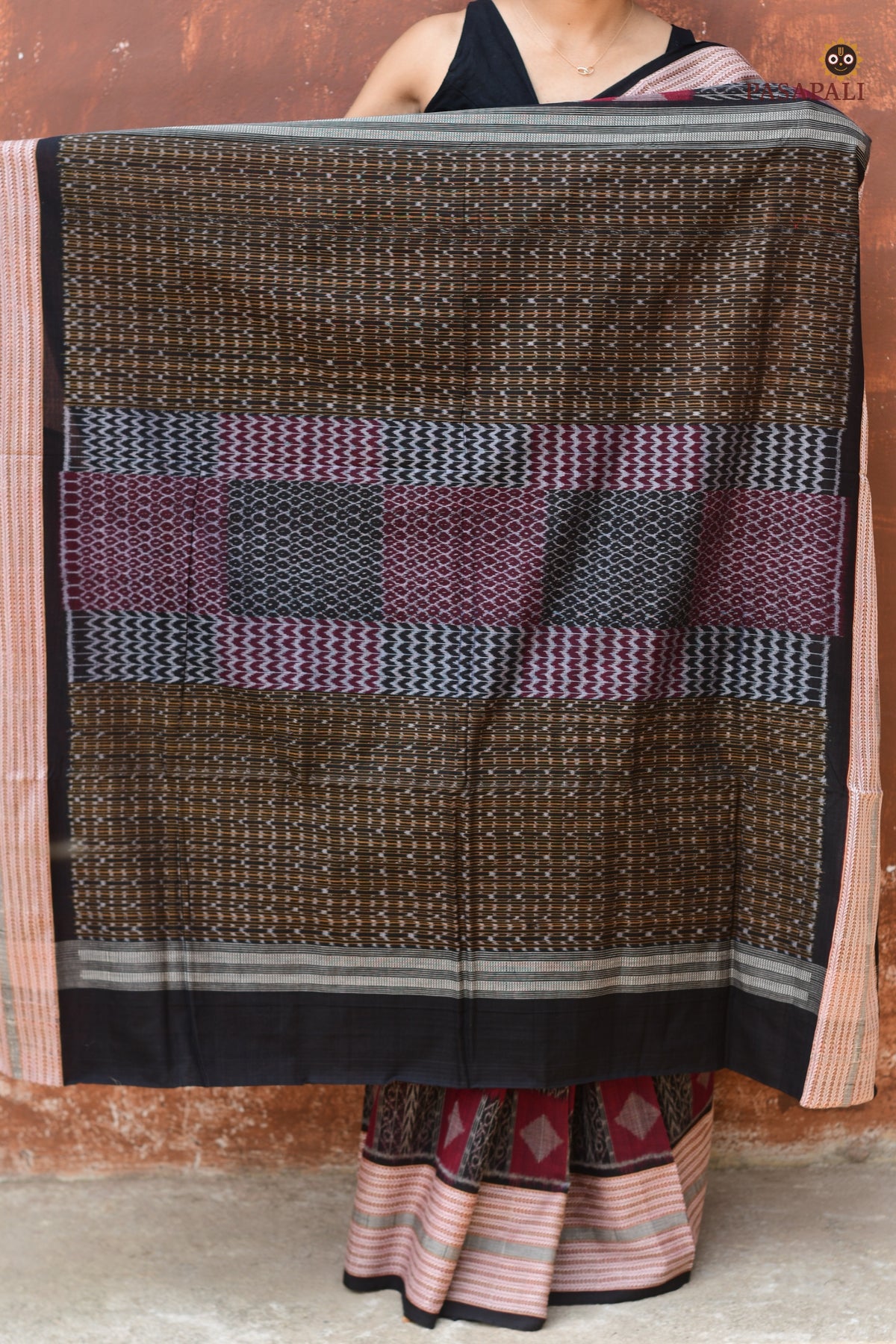 Lopamudra — folded saree showing maroon and black palette of Sambalpuri Bandha cotton saree by Pasapali