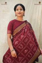 Load image into Gallery viewer, Mahalakshmi maroon Sambalpuri Bandha cotton saree flat lay — lotus, yantra &amp; paduka motifs, Pasapali
