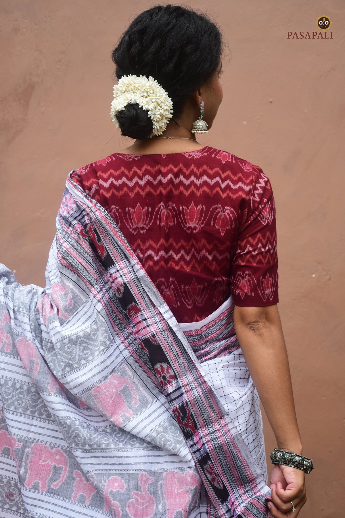 Malini white mercerized cotton Sambalpuri saree — hero view of Sachipar weave with danti body and khajur border