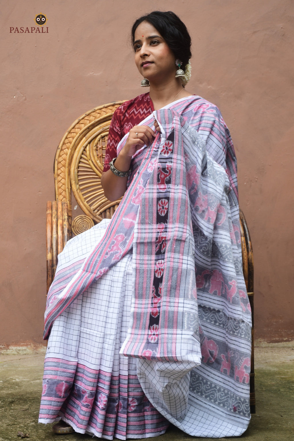 Front drape of Malini GI certified Sambalpuri cotton Sachipar saree — white with ikat pallu motifs by Pasapali