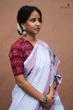 Malini Sachipar pallu detail — traditional ikat fish and flower motifs in white Sambalpuri handloom by Pasapali