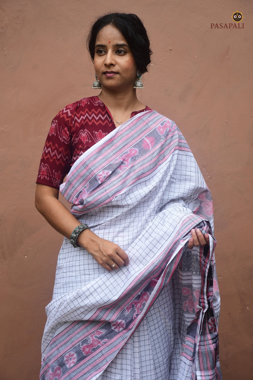Malini white Sambalpuri handloom saree — front drape showing danti checks and chevron khajur border in mercerized cotton