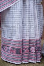 Malini Sambalpuri cotton saree pallu close-up — Bandha ikat flower, fish, duck, deer and elephant motifs in white