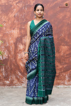 Close-up of solid green kumbha border on Mandakranta blue Sambalpuri Bandha cotton saree by Pasapali, Odisha