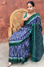 Mandakranta blue Sambalpuri cotton saree folded to show ikat stripe body and green kumbha border detail by Pasapali