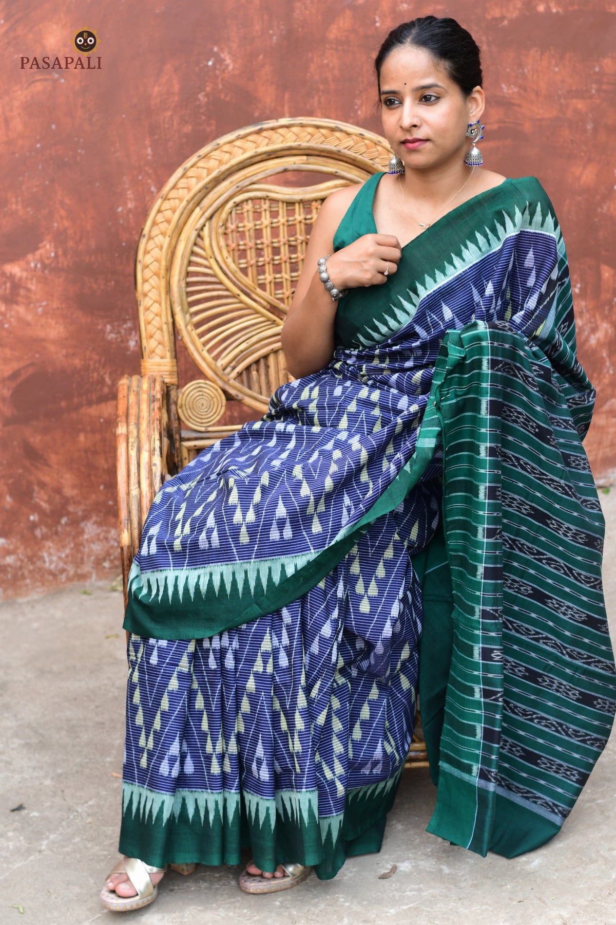 Mandakranta blue Sambalpuri cotton saree folded to show ikat stripe body and green kumbha border detail by Pasapali