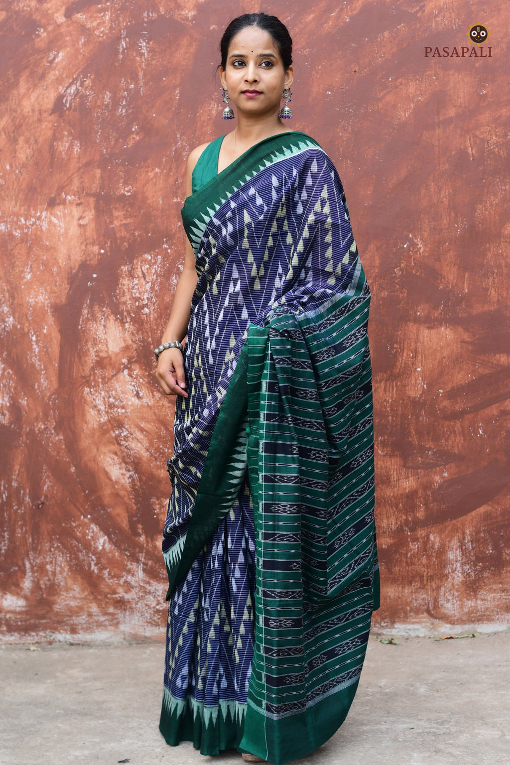 Handloom drape view of Mandakranta Sambalpuri Bandha saree in blue and green mercerized cotton by Pasapali
