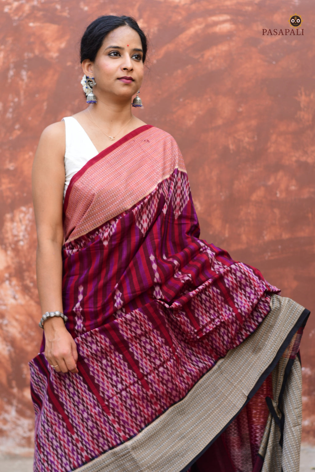 Mandira burgundy Sambalpuri cotton saree — front drape showing geometric ikat body and rudraksha border detail | Pasapali