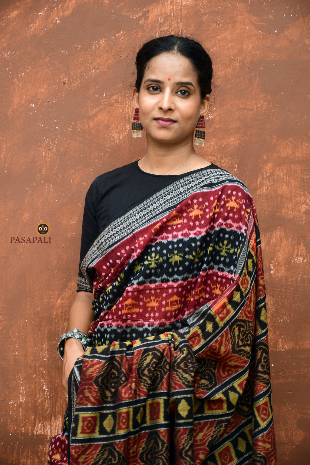 Matangi — front drape view of maroon Sambalpuri cotton saree showing Bandha double ikat weave detail by Pasapali