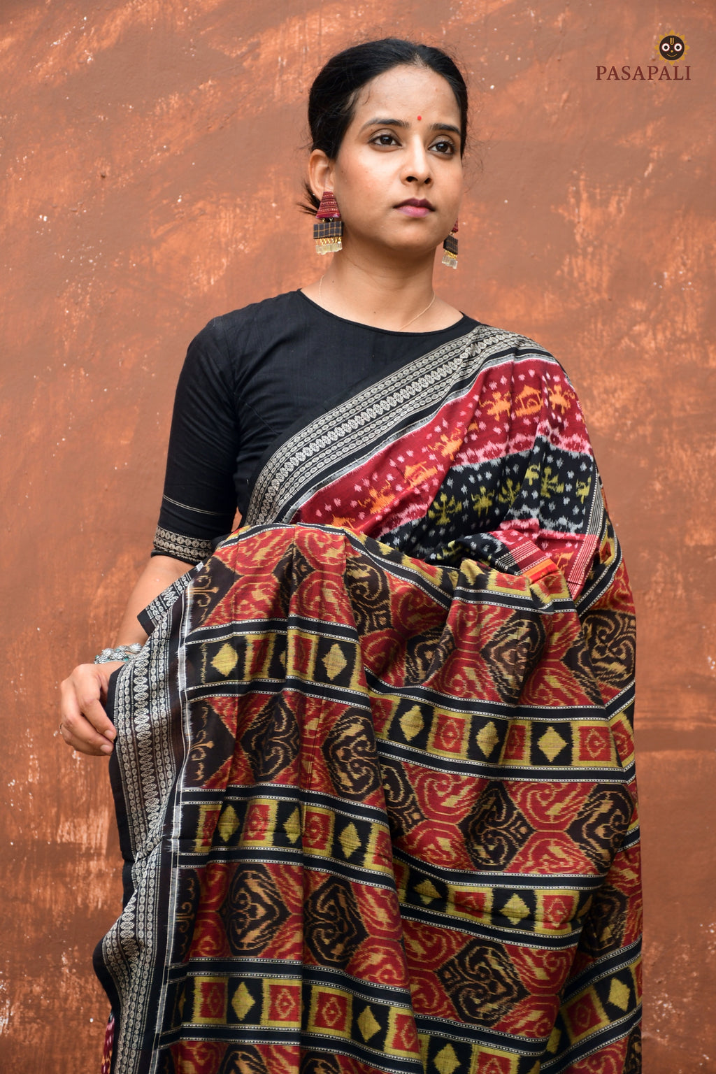Matangi — body weave detail of tribal and flower double ikat motif on maroon Sambalpuri cotton saree by Pasapali