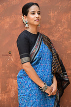 Mohini Blue Sambalpuri Bandha mercerized cotton saree by Pasapali — full view with tribal & floral body and ikat border