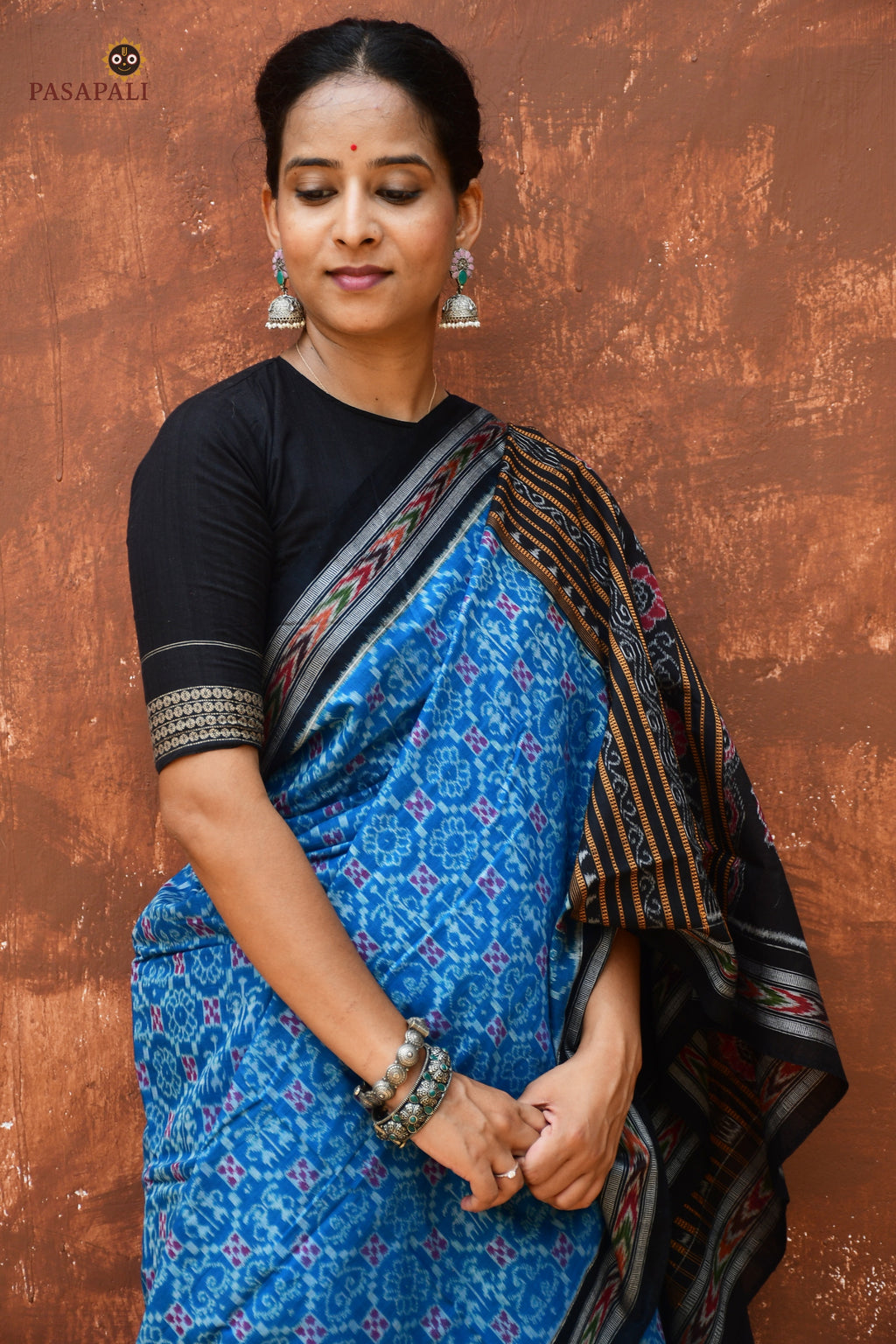 Mohini Blue Sambalpuri Handloom saree — pallu detail showing Laxmi yantra, Laxmi pada and flower motifs, Bhulia weavers