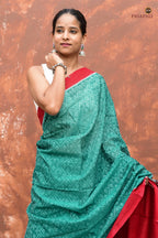 Mrinmayee green Sambalpuri cotton saree front drape — solid red border and fish motif body by Pasapali