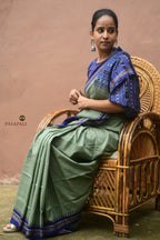 Flat lay of Nalini GI certified Sambalpuri cotton saree — greenish grey and blue, Ek Phulia border, Pasapali handloom