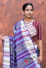 Load image into Gallery viewer, Flat lay of Narmada blue Kotpad natural dye saree — full length Tussar Cotton Silk, phoda kumbha border, tribal motifs, Pasapali
