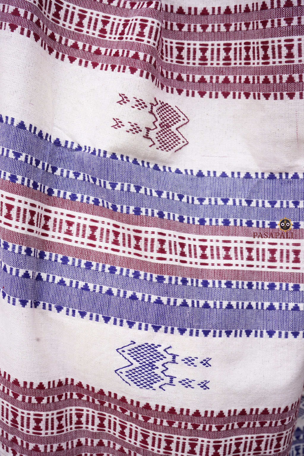 Pallu weave close-up of Nirjhari Kotpad saree — fish and axe motifs, extra-weft technique, natural dye cotton