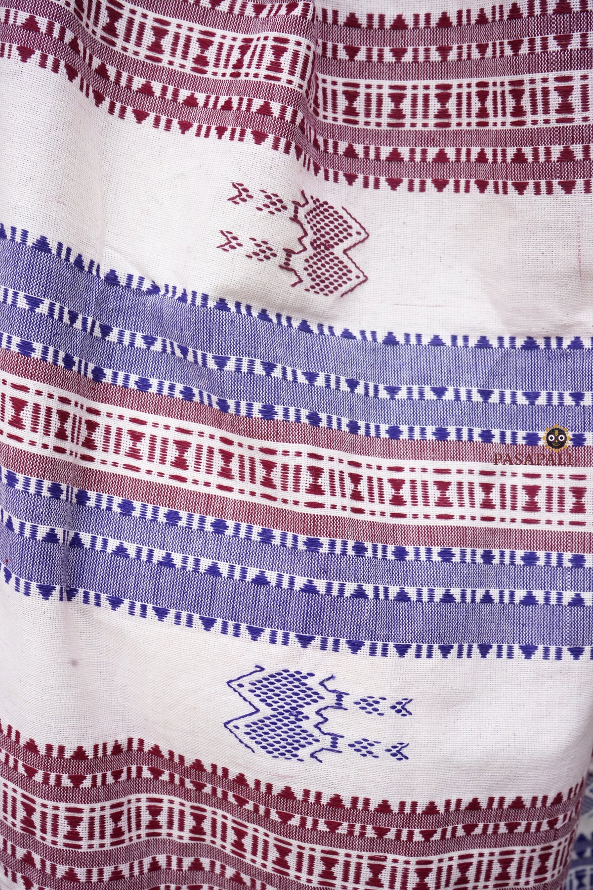 Pallu weave close-up of Nirjhari Kotpad saree — fish and axe motifs, extra-weft technique, natural dye cotton