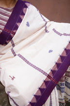 Handloom drape view of Nirjhari Kotpad saree — natural vegetable dye, tribal kumbha border, Pasapali Odisha