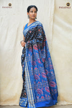 Flat lay of Nishigandha black Sambalpuri Bandha saree — full 5.40 m length with blue pallu and fish border, Pasapali