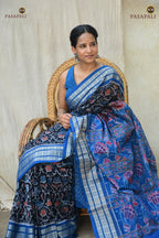 Nishigandha Sambalpuri handloom saree — hero full view showing black ground and blue ikat pallu, Pasapali Odisha