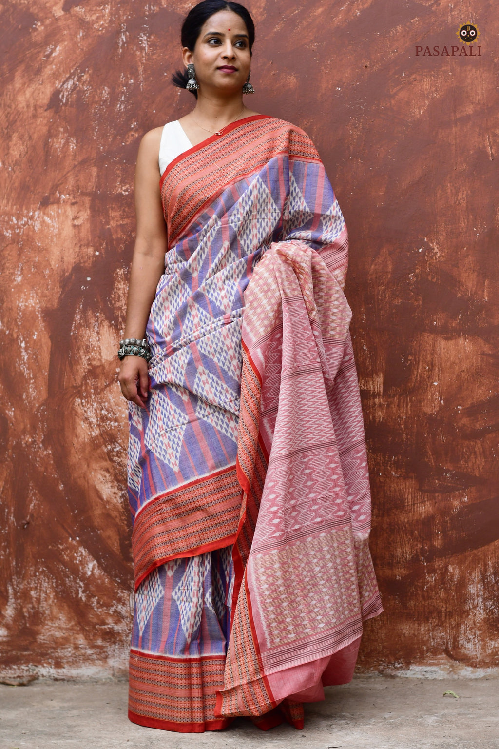 Nityarekha light blue Sambalpuri cotton saree draped front view showing rust contrast and diamond body — Pasapali