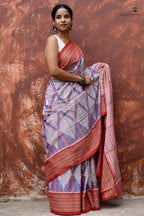 Nityarekha pallu close-up showing traditional ikat geometrical patterns in Sambalpuri Bandha weave — Pasapali