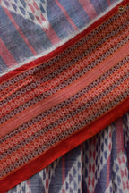 Nityarekha light blue Sambalpuri handloom saree folded showing pallu ikat geometry and rust double border