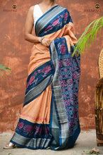 Load image into Gallery viewer, Padmavati Sambalpuri cotton saree draped front view — cream and teal Bandha ikat weave with flower motif pallu, Pasapali
