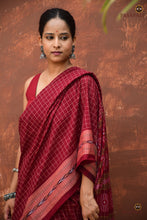 Load image into Gallery viewer, Parampara — close-up of Rudraksha motif border on maroon Sambalpuri Bandha cotton saree by Pasapali
