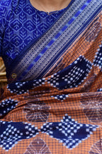 Flat lay of Pashini Brown Sambalpuri Bandha mercerized cotton saree showing full length, pallu and border — Pasapali
