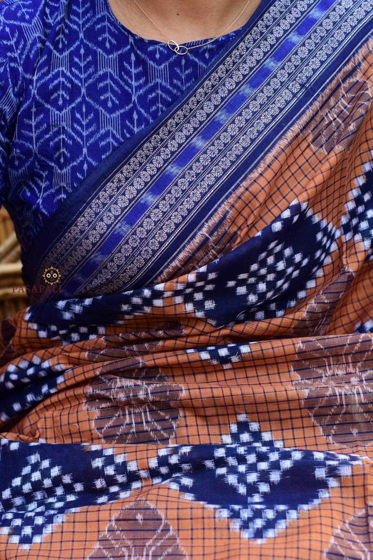 Flat lay of Pashini Brown Sambalpuri Bandha mercerized cotton saree showing full length, pallu and border — Pasapali
