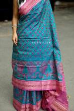 Load image into Gallery viewer, Teal handloom Bandha saree with shankh motifs and pink blouse with buta – Pasapali
