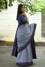 Load image into Gallery viewer, Handwoven sky blue Sambalpuri saree featuring intricate ikat buta design and elegant blue pallu
