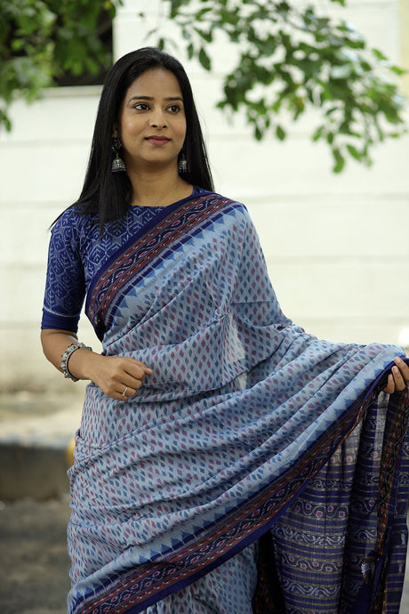 Sky blue Sambalpuri cotton saree with tiny ikat buta motifs and rich blue ikat border – Pasapali