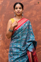Phuljaal authentic Sambalpuri handloom saree — overhead view, teal blue mercerized cotton