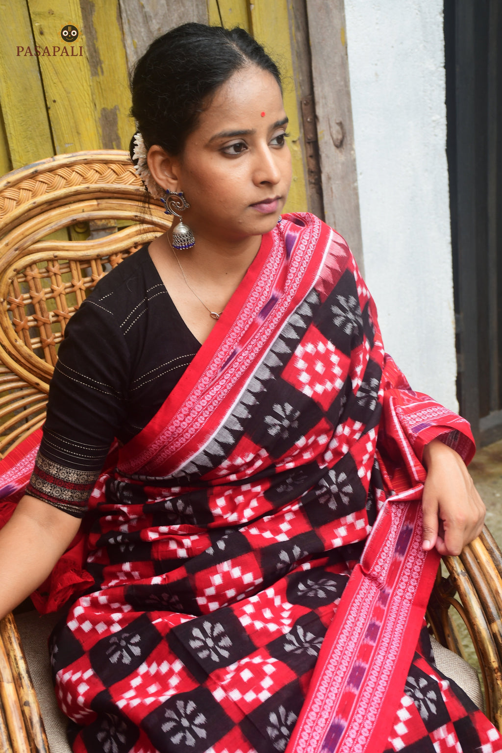 Handloom drape view of Pramodini Sambalpuri Bandha double ikat saree in red mercerized cotton — Pasapali