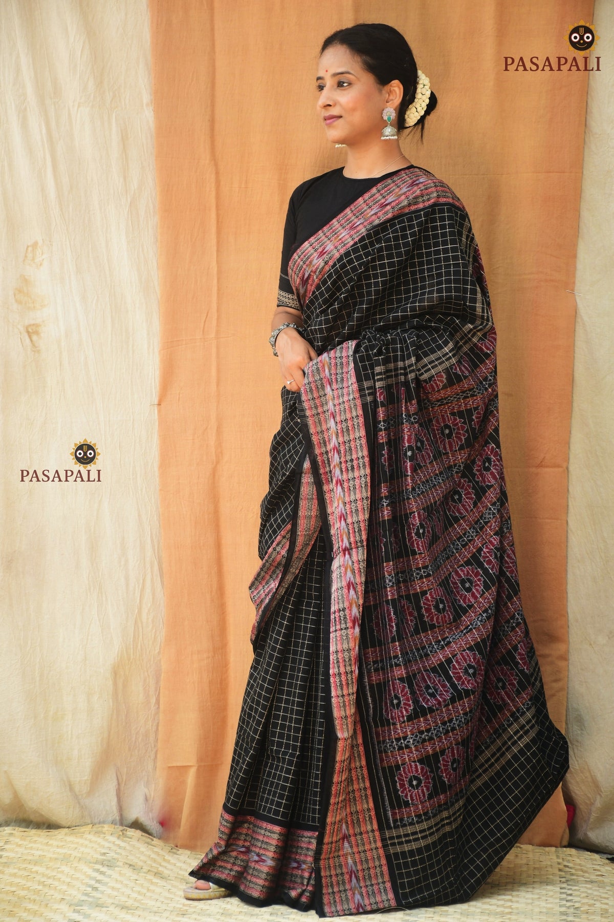 Purvasha Sambalpuri Bandha saree draped front — black jala Daanti body with ikat pallu, Pasapali Odisha
